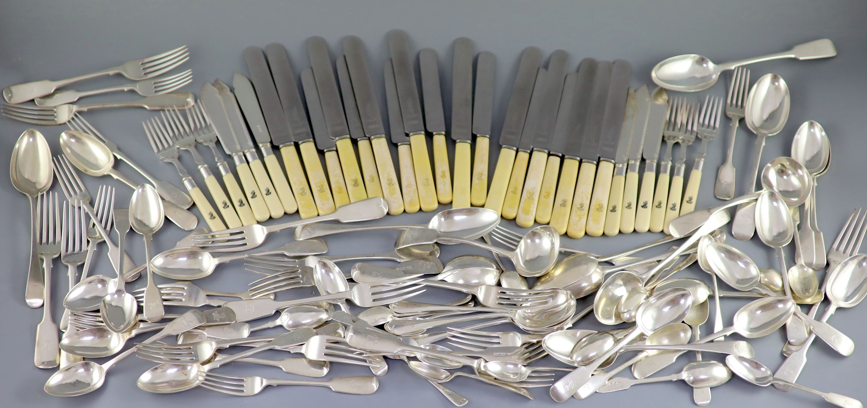 A 19th/20th century century harlequin canteen of silver fiddle and Old English pattern cutlery, comprising ninety seven items, mainly Josiah Williams & Co, London, 1900